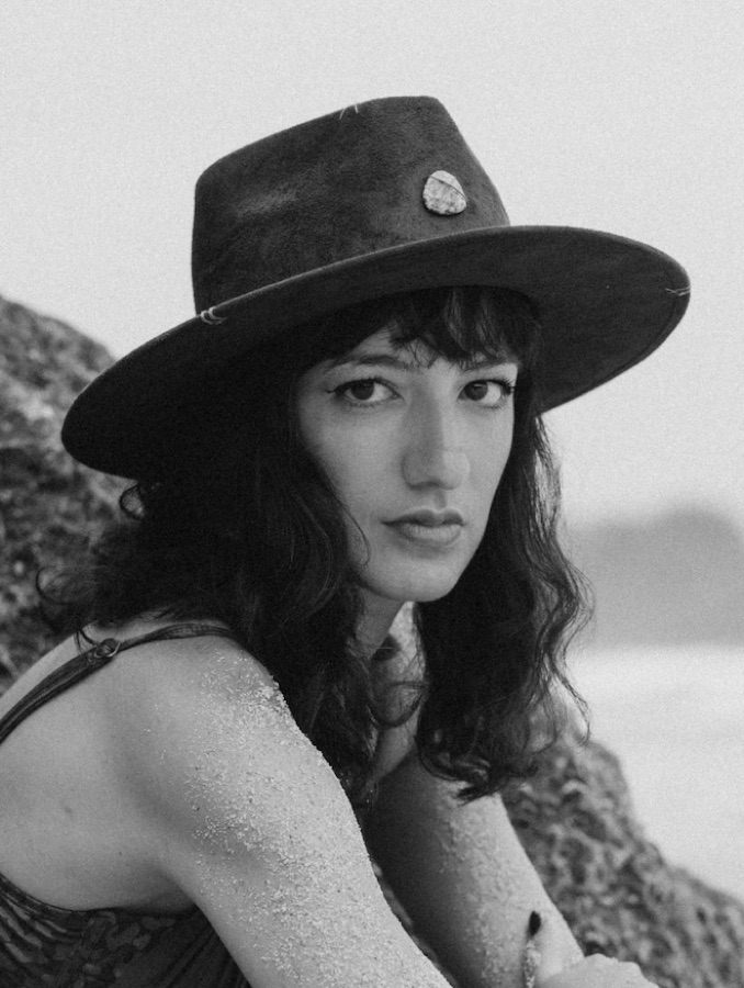 Imen, founder of Prima Materia, portrait by the sea